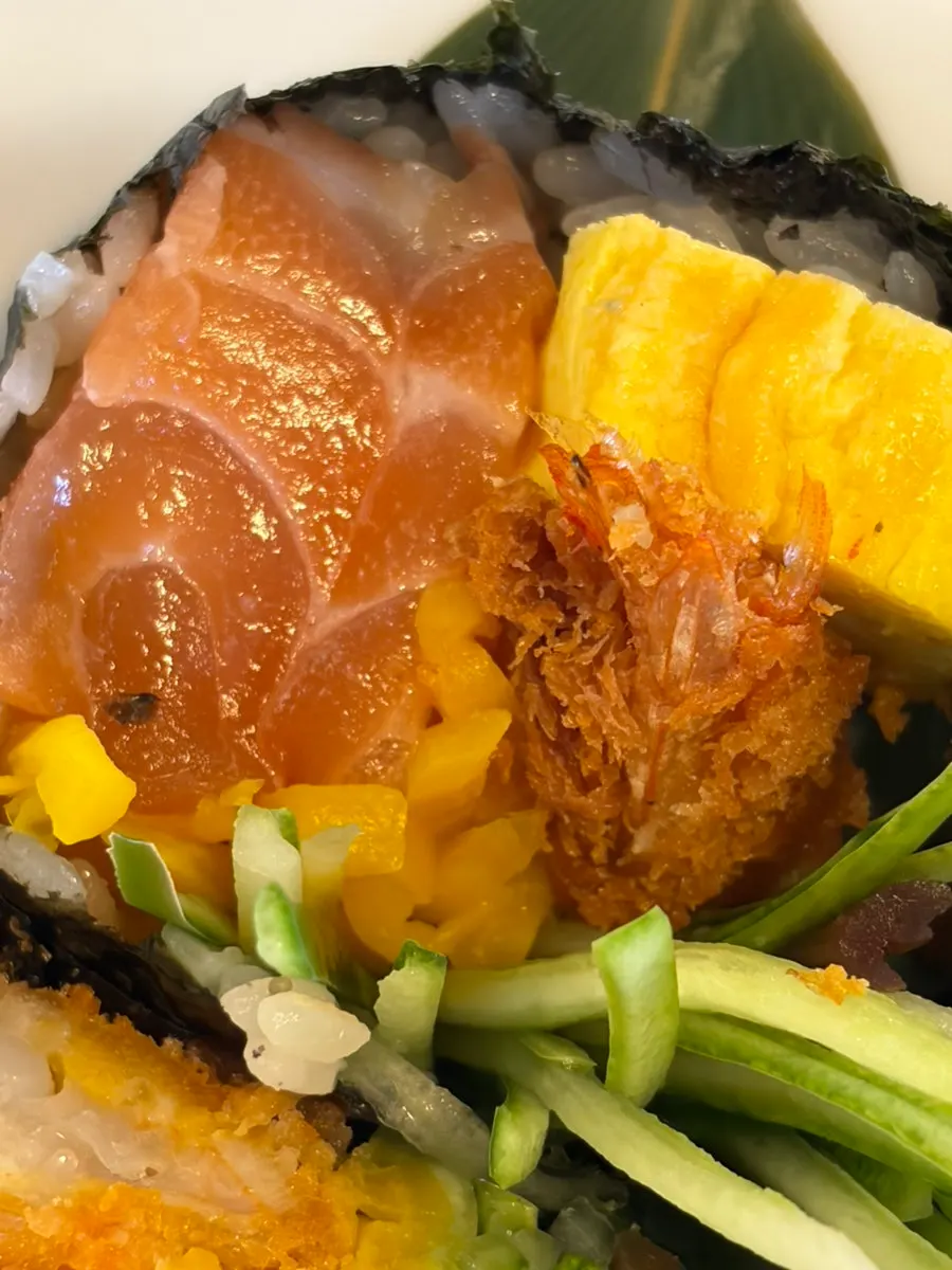 An abundant pairing of salmon futomaki and soba