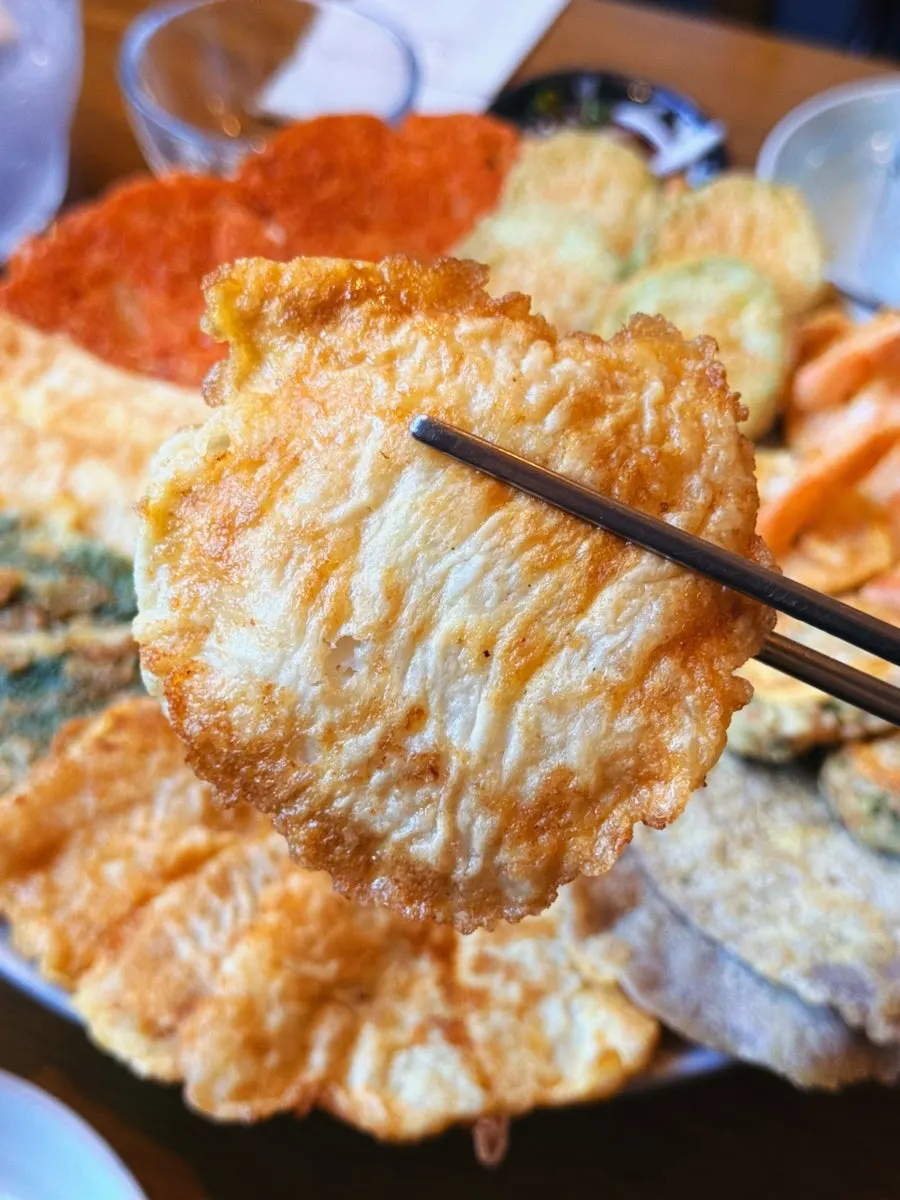 Close-up of golden-fried assorted jeon