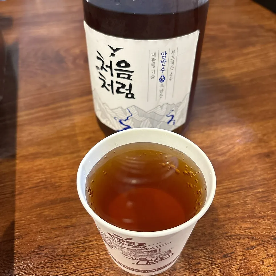 A cup of dark-colored heotgae-su