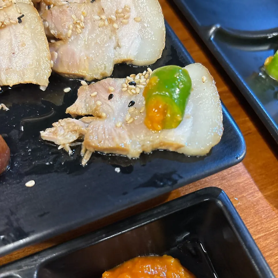 Bossam wrapped with spicy kimchi filling