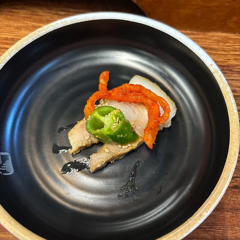 Close-up of a bossam wrap bite