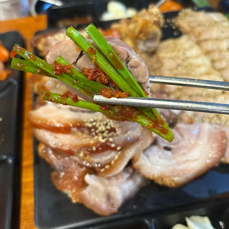 Jokbal and bossam served with chive salad