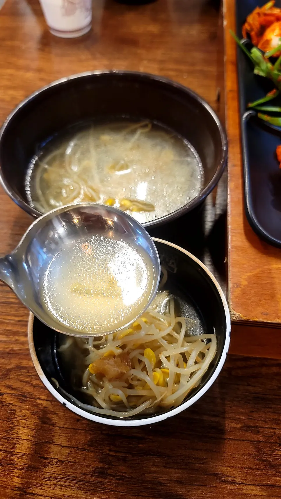 Table setting with side dishes and bean sprout soup