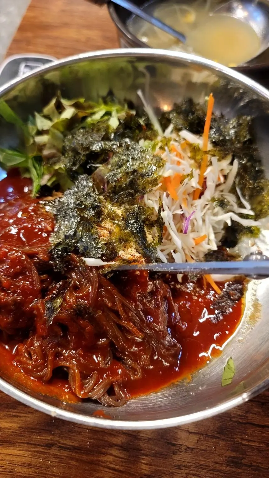 Bowl of complimentary fresh-fruit makguksu