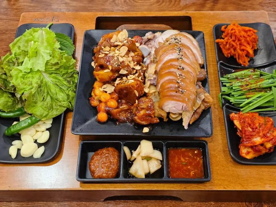 Full jokbal spread with side dishes set on the table