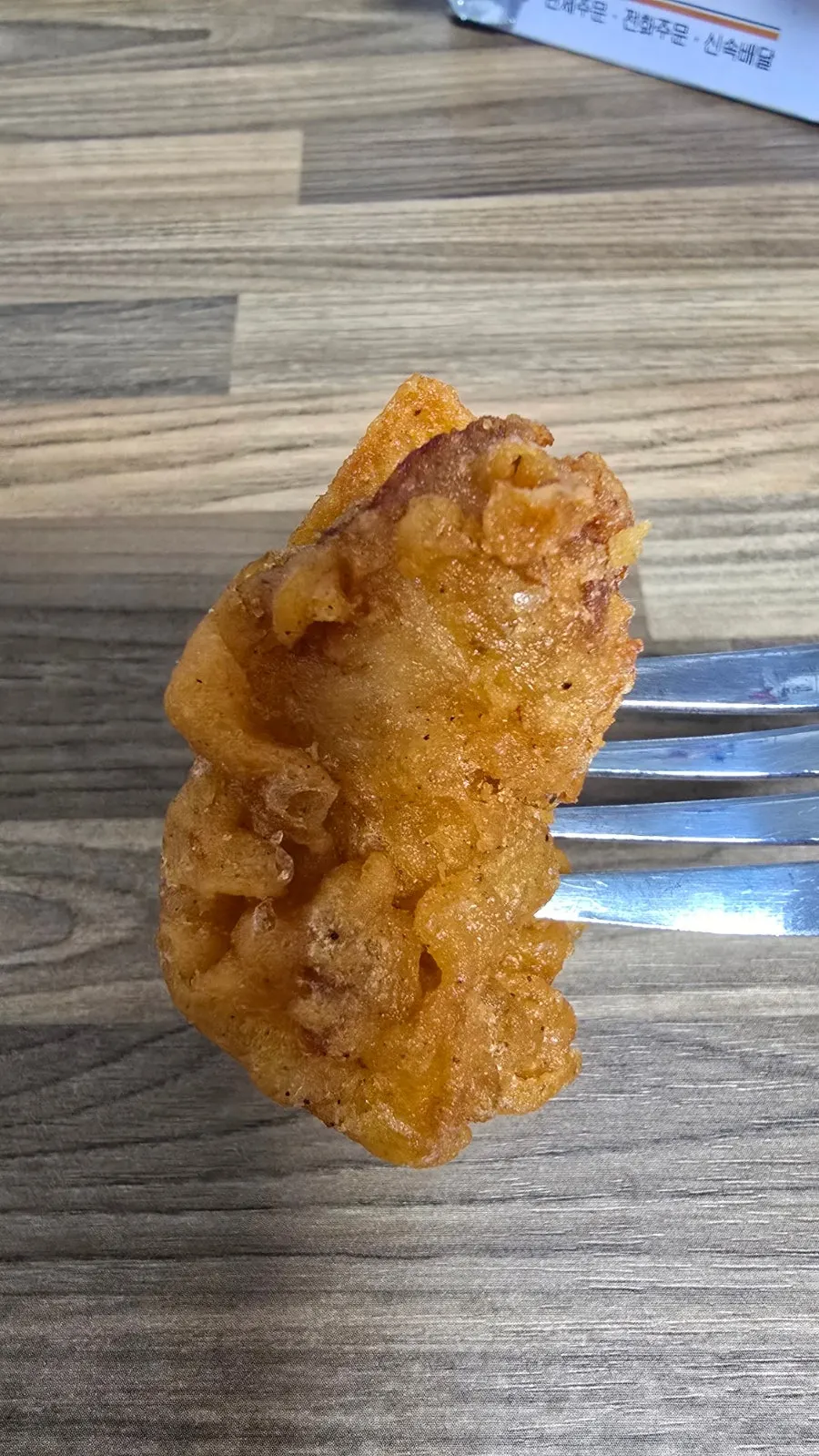 Cross-section of dakgangjeong still crispy after takeout