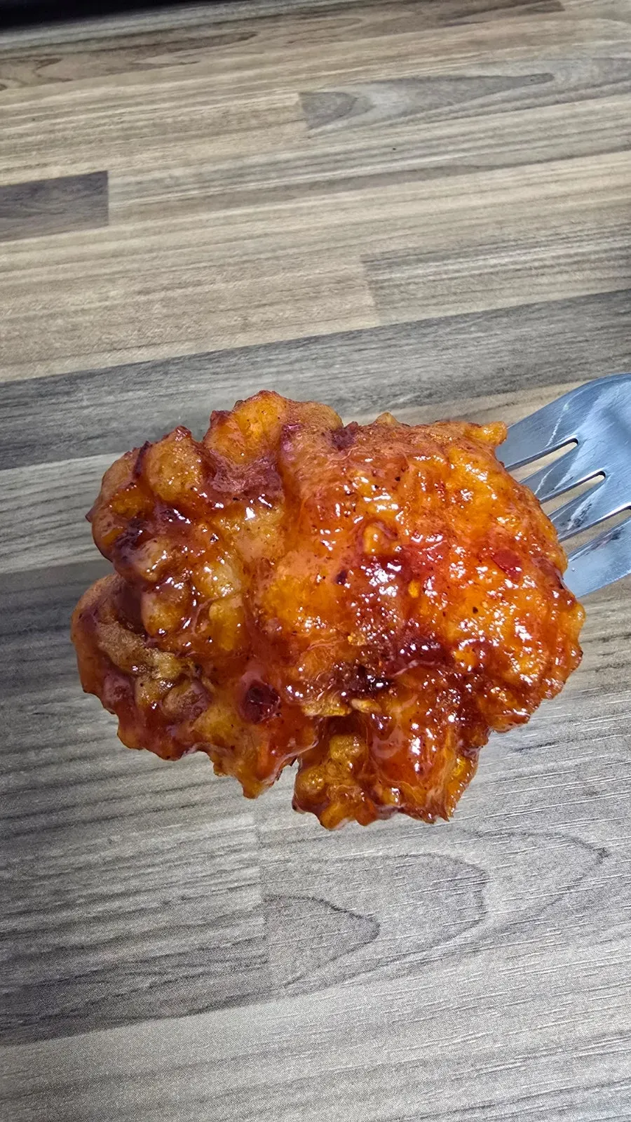 Seasoned dakgangjeong with fried rice cake skewers