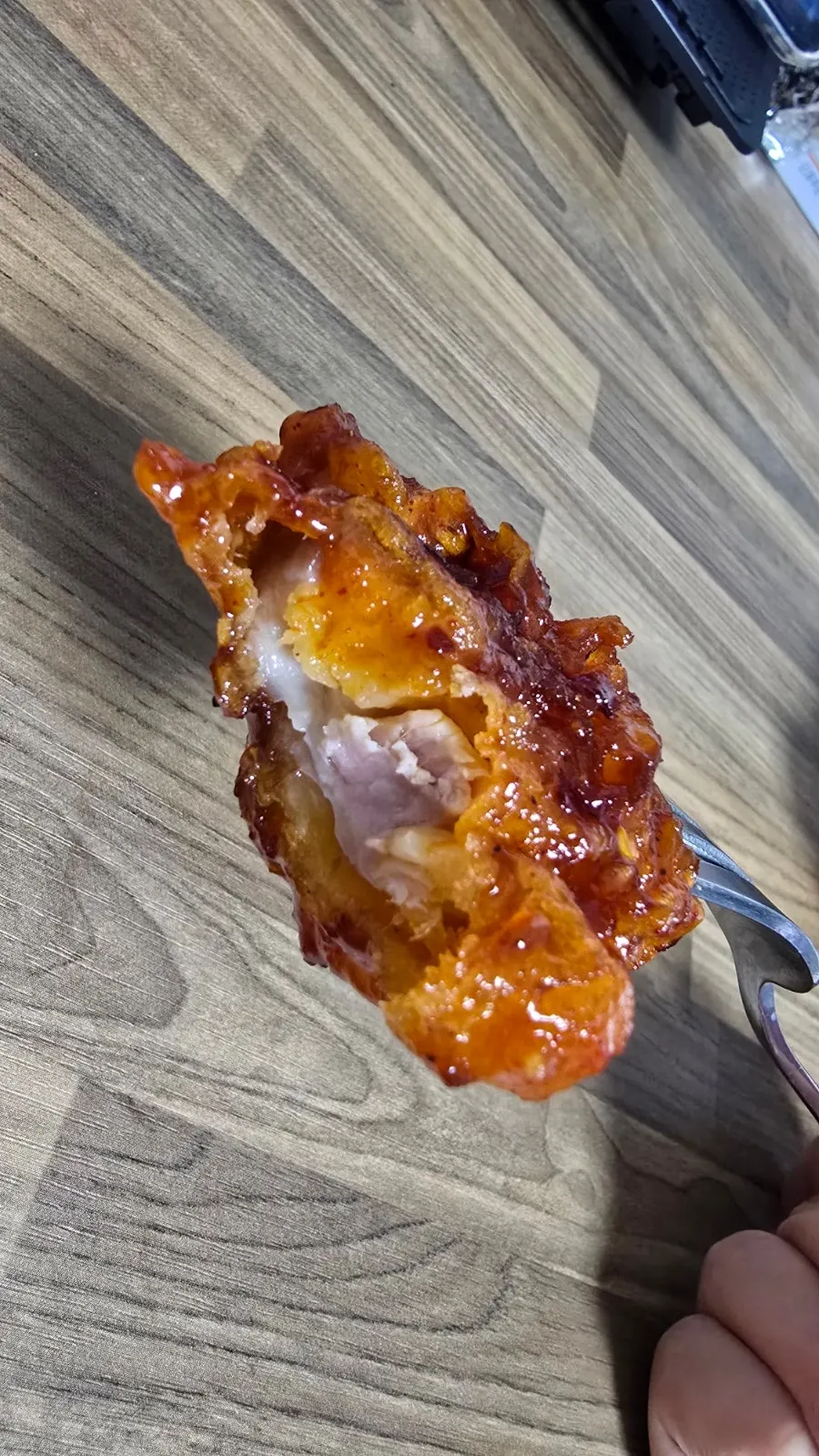 Cross-section of seasoned dakgangjeong showing the meat inside