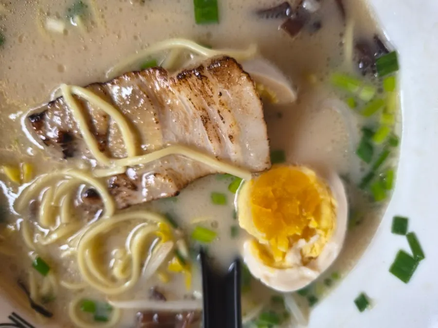 Soft-boiled egg and wood ear mushrooms in the ramen