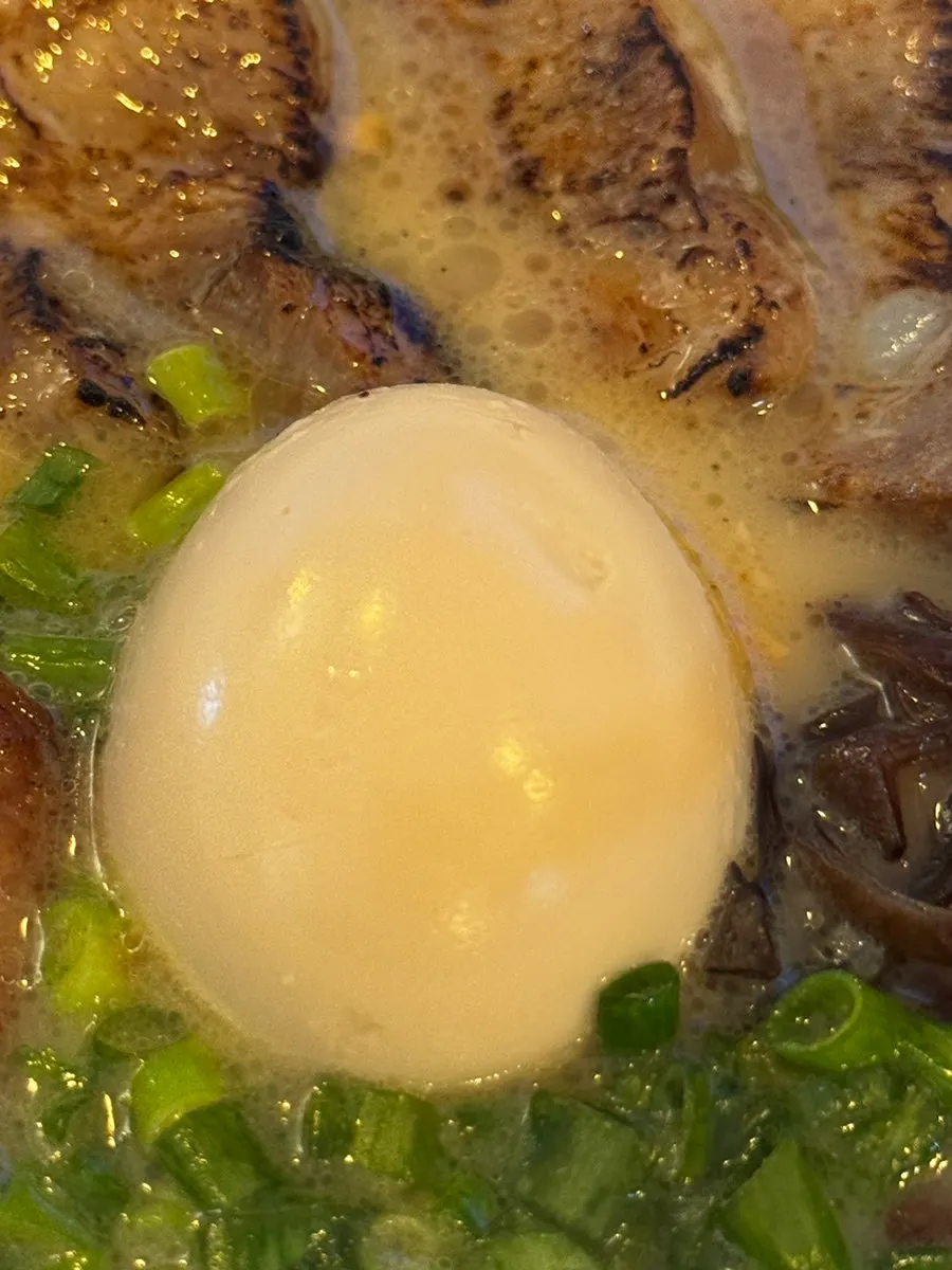Ramen broth with the spicy sauce added