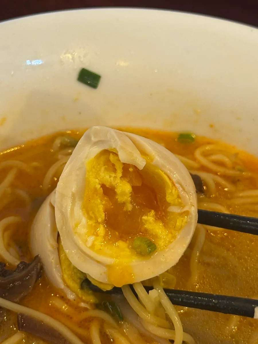 Spicy broth with soft-boiled egg