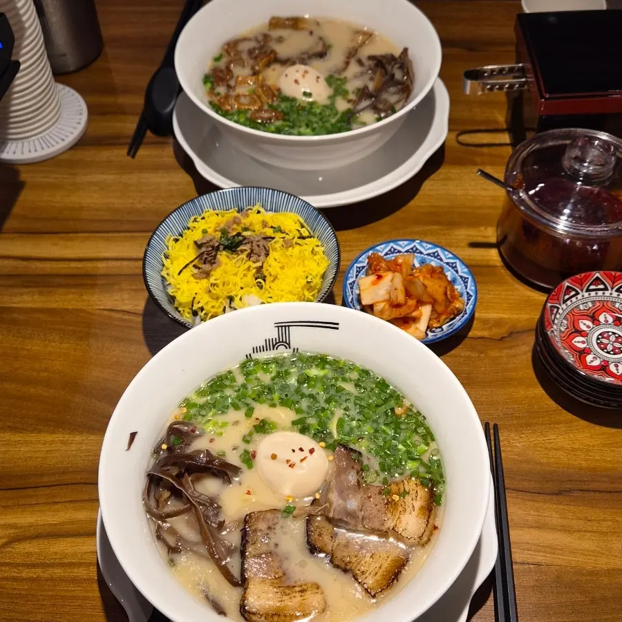 Gyedan Ramen, Motsu Ramen, and tamagobap laid out together