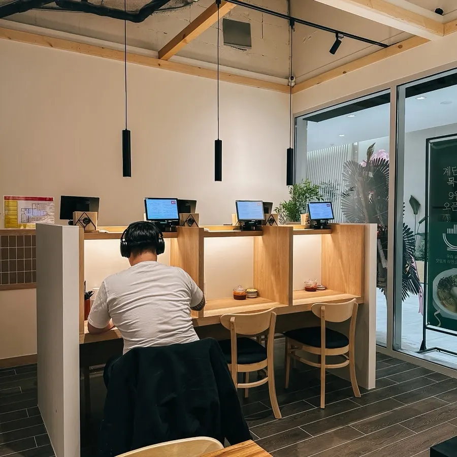 Wood-tone seating at Gyedan Ramen Mokdong Branch