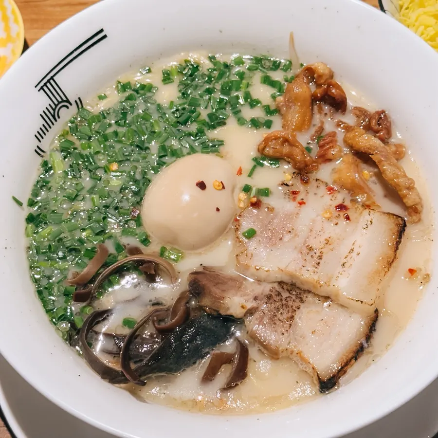 Motsu ramen topped with fried pork intestines