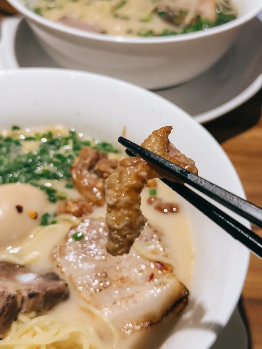 Crispy fried pork intestine topping on motsu ramen