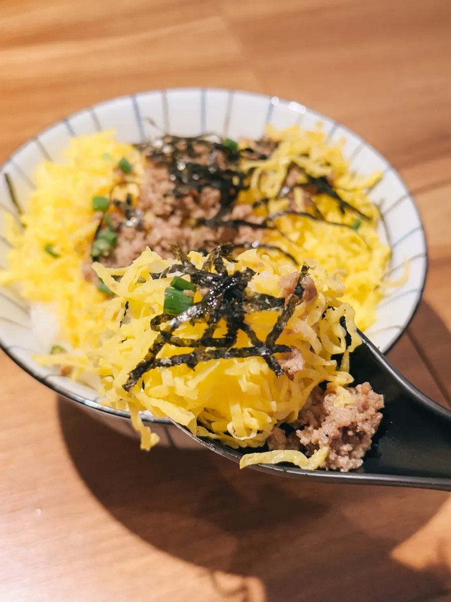 Tamagobap topped with shredded egg and seaweed flakes