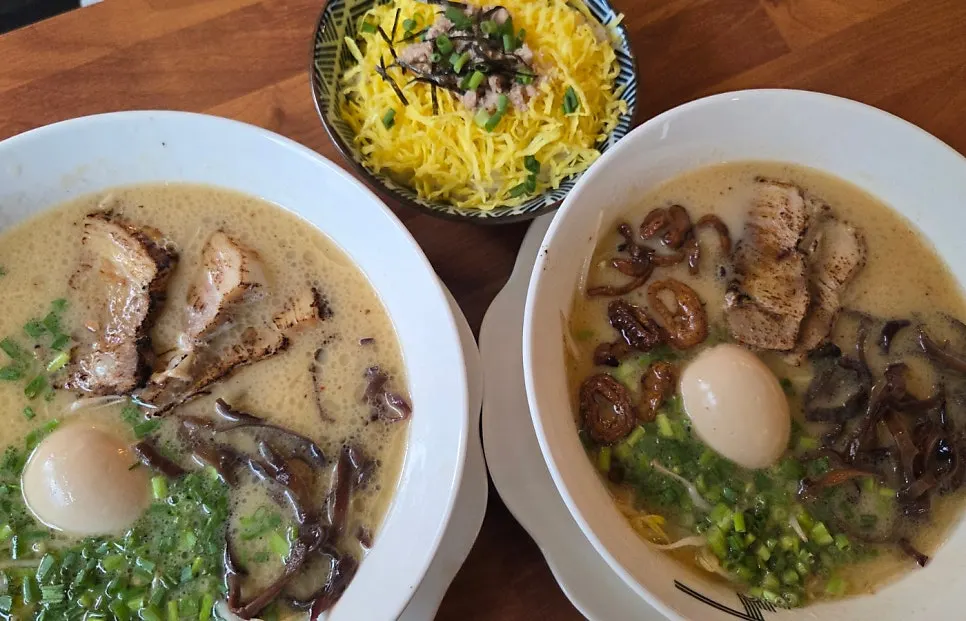 Gyedan Ramen, Motsu Ramen, and tamago-bap spread on the table