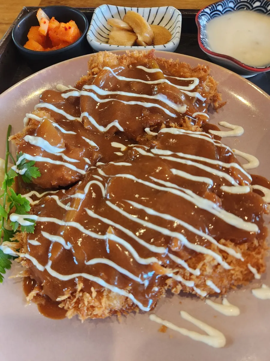 Large gyeongyangsik donkatsu generously covered in sauce