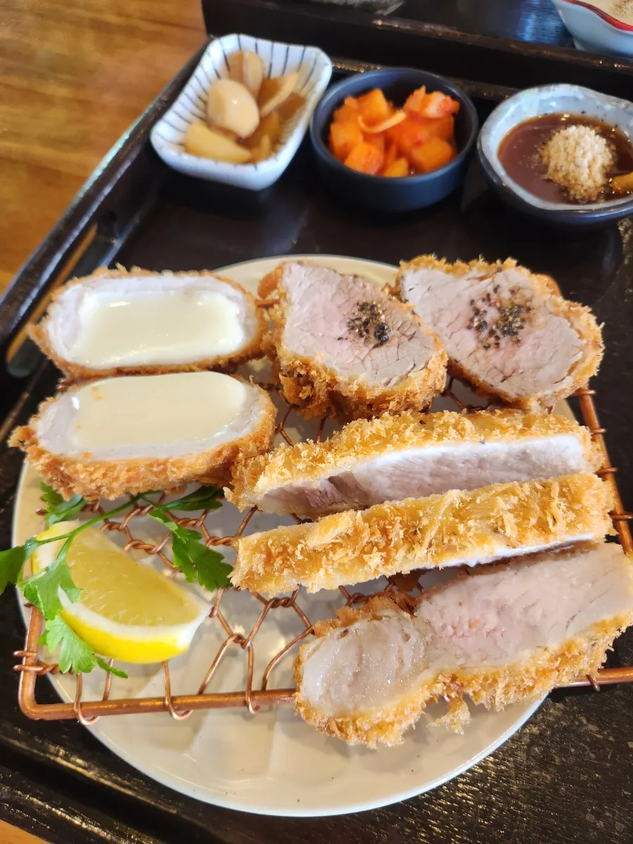 Three pieces of crispy-breaded sirloin donkatsu