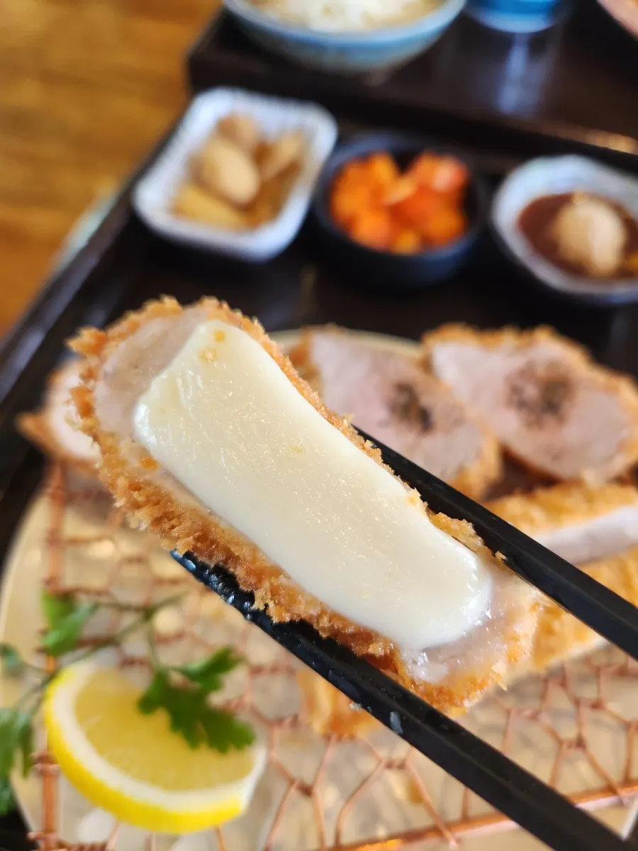 Cross-section of cheese donkatsu packed with cheese