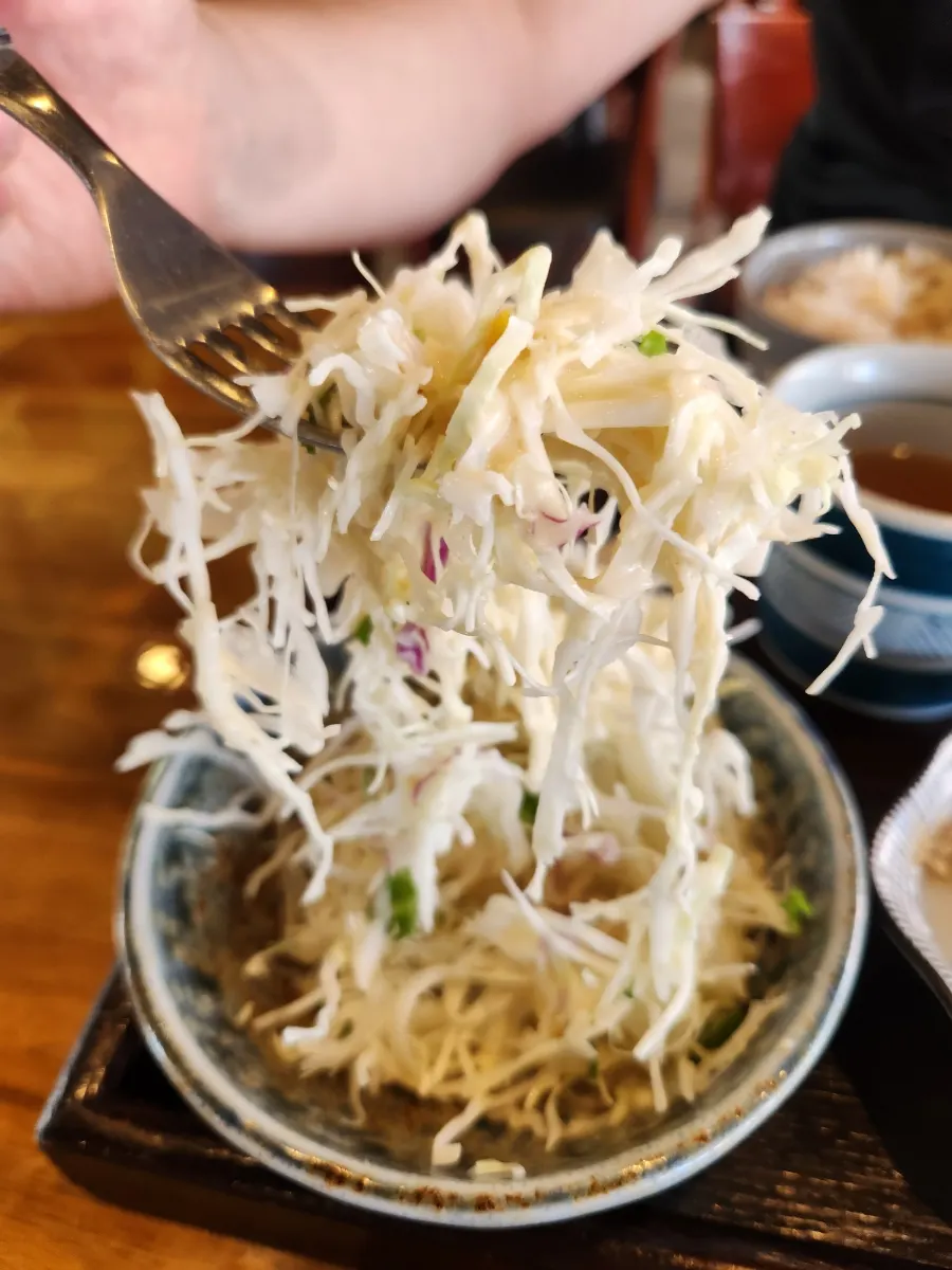 Salad drizzled with yuzu dressing