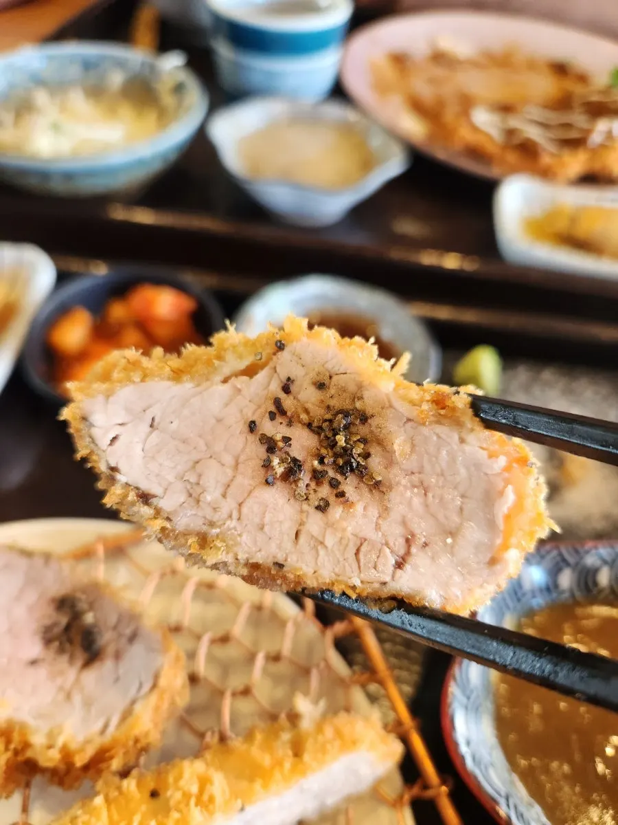 A plate of Gyeomson Donkatsu enjoyed with various accompaniments