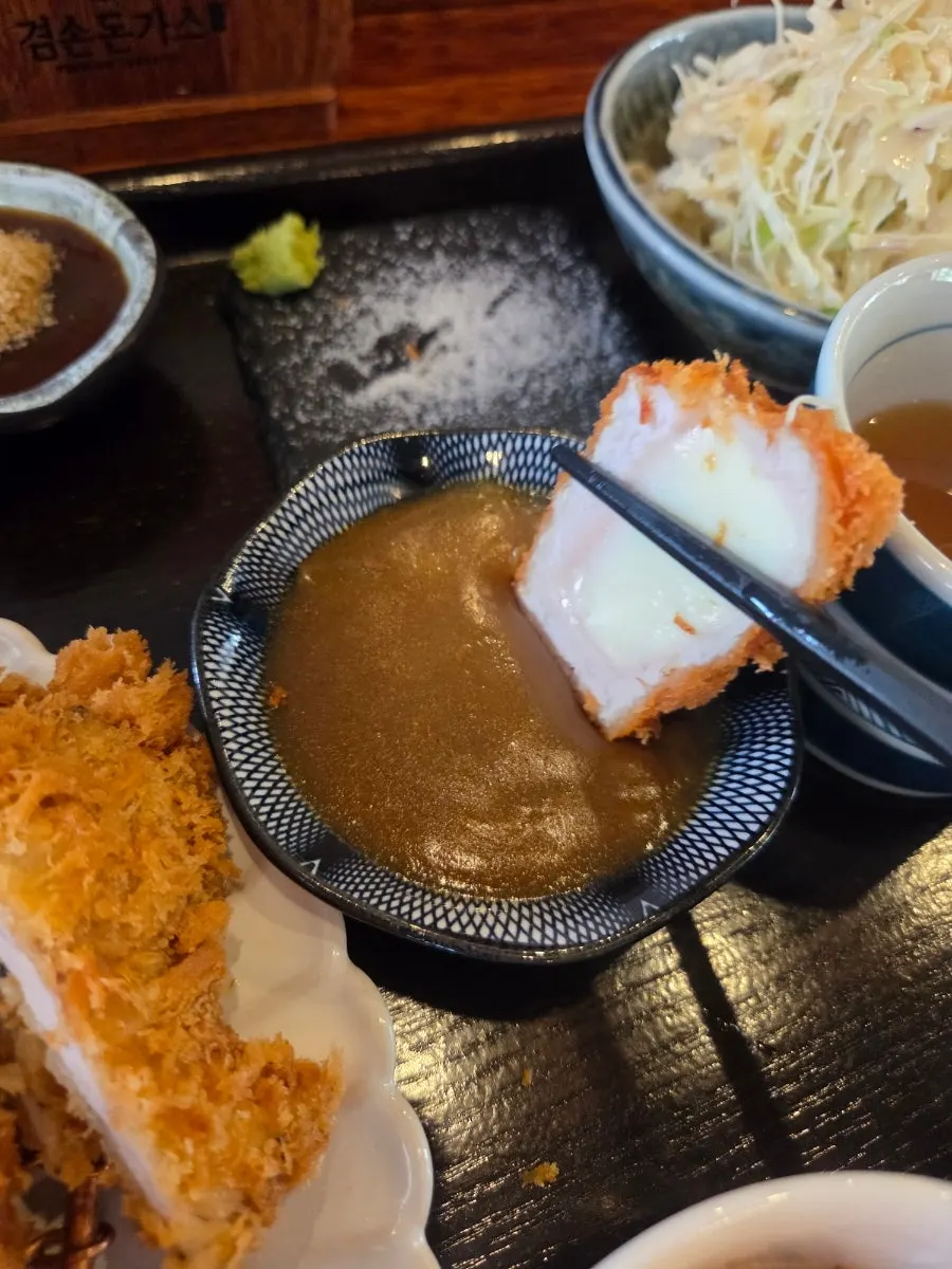 A piece of pork cutlet topped with wasabi
