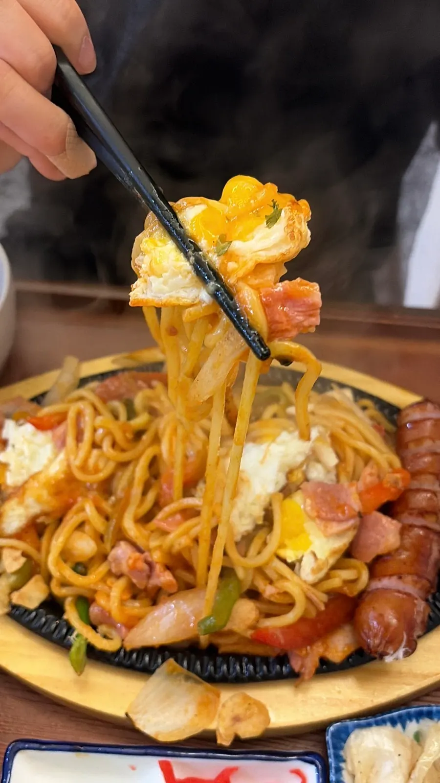 Chopsticks lifting the yakisoba Napolitan