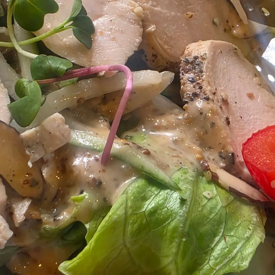 Salad topped with almonds and nuts
