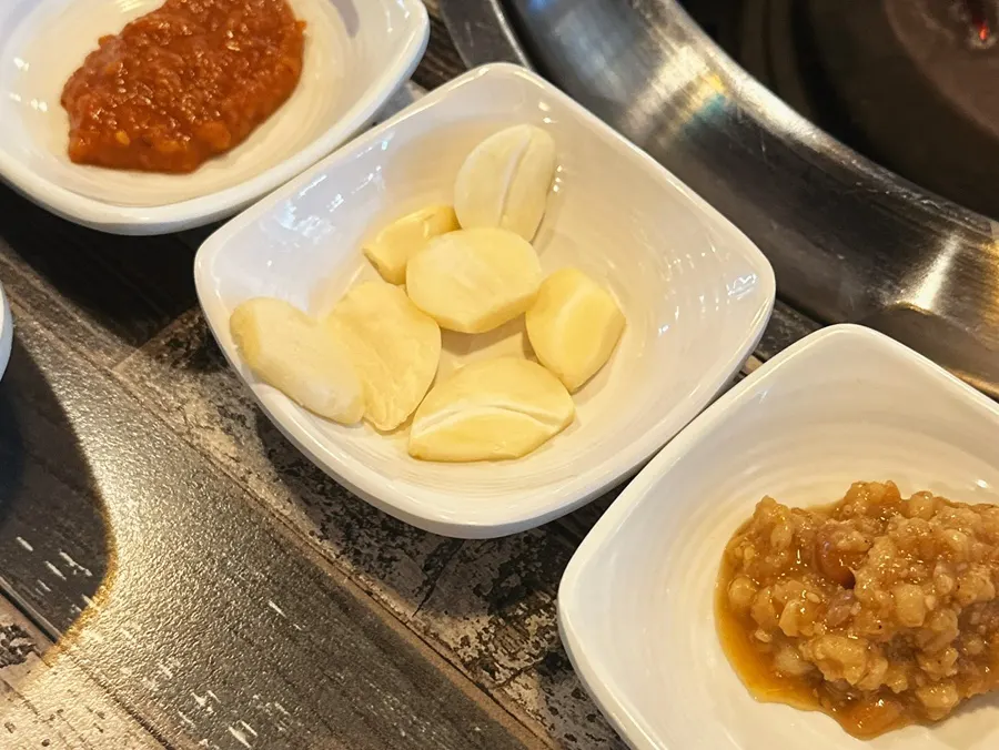 Kimchi, cabbage, and other side dishes at Galbi Yechan