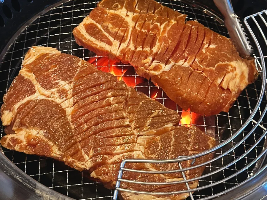 Seasoned pork ribs eaten alongside side dishes