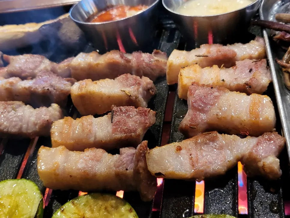 Staff grilling black pork
