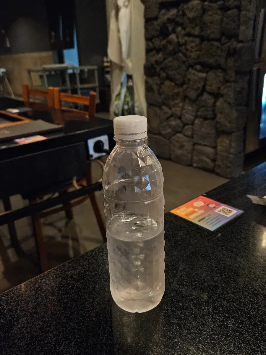 Bottled water served at the table
