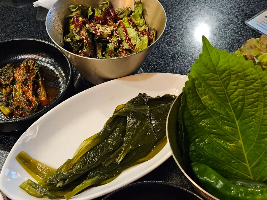 Side dishes including myeongi namul (wild garlic leaves)