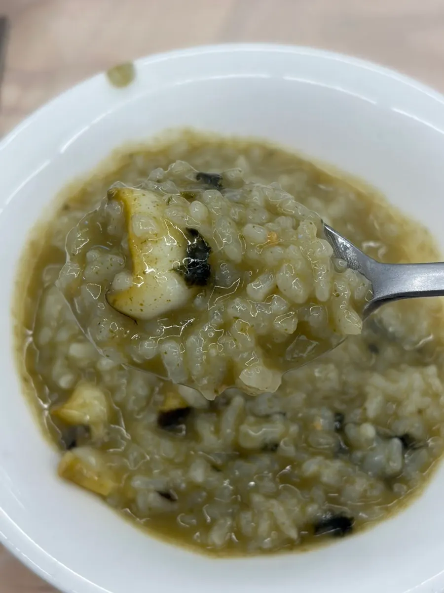 Close-up of abalone porridge with plenty of abalone pieces