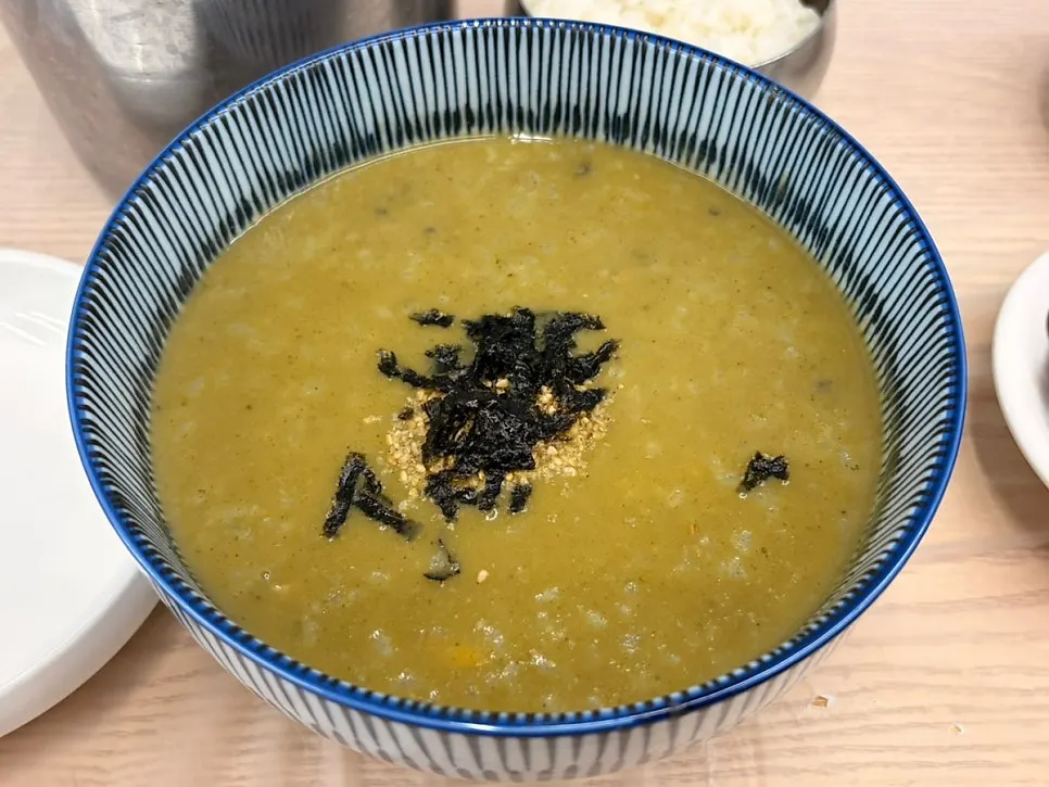 Table setting with small abalone seafood stew and abalone porridge