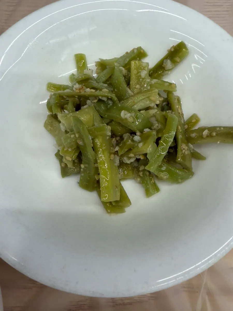 Collection of side dish plates at Wando Cham Jeonbokjip