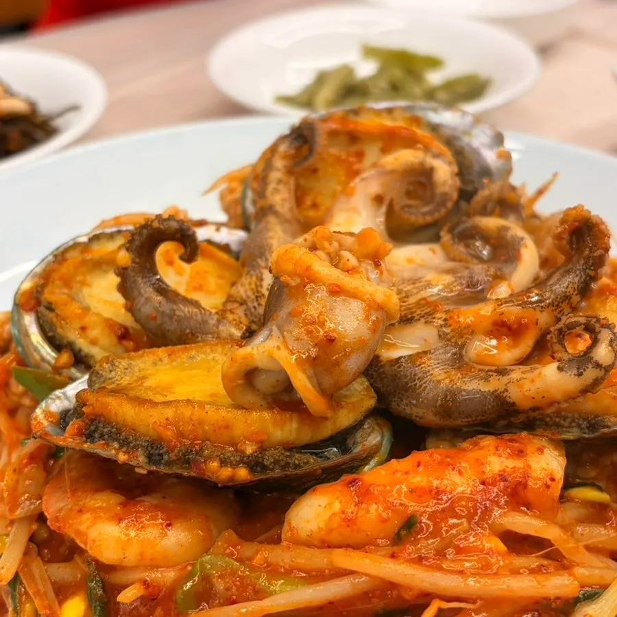 Small abalone seafood stew with 4 abalones on top