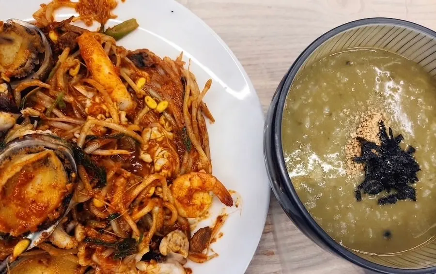 A table set with the small abalone seafood stew and abalone porridge