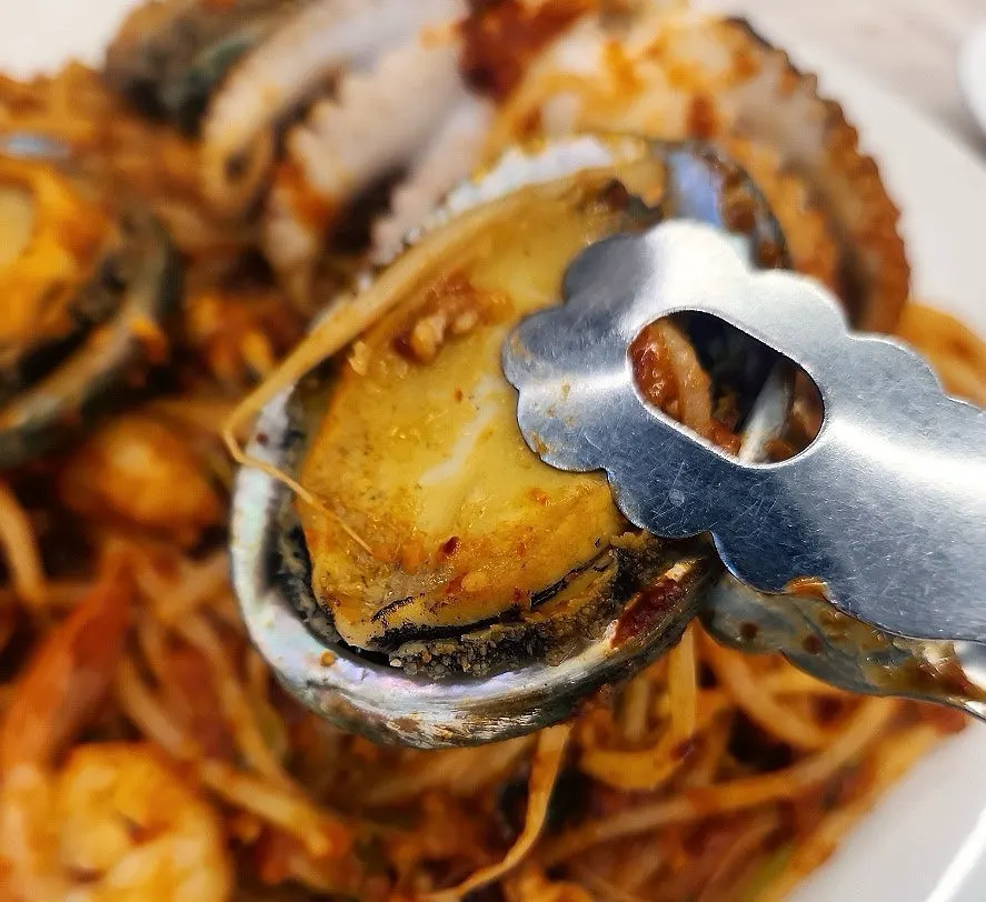Abalone and octopus coated in the seasoning sauce