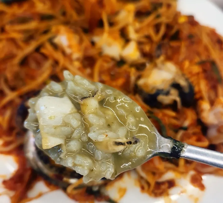 Abalone porridge served together with the seafood stew