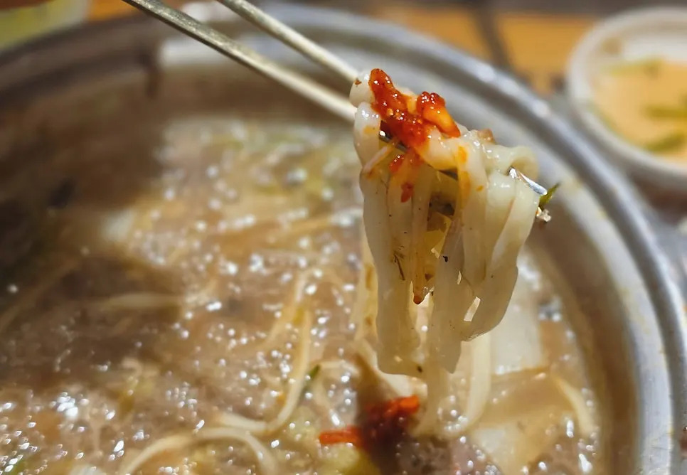 Kalguksu noodles cooked in broth