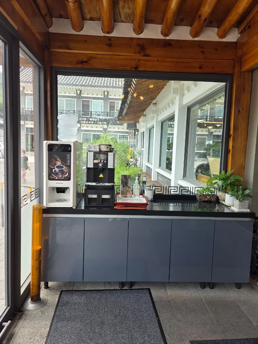 The dining hall interior and self-serve coffee corner at Tobagi Sikdang
