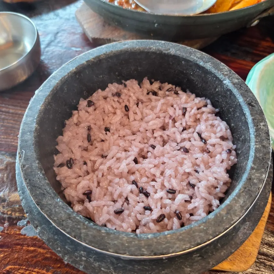 Stone pot rice with the rice scooped out and water poured in for sungnyung