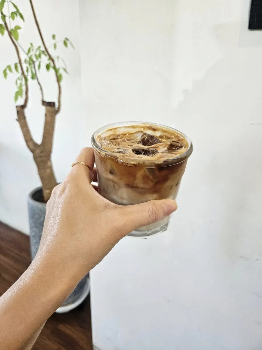 Iced café latte with bakery items