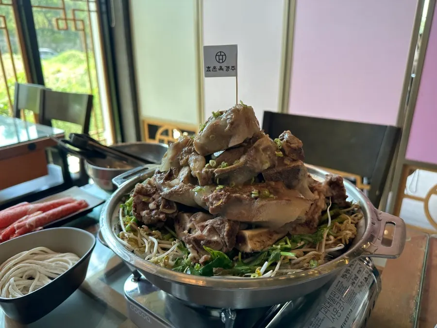 The signature Ppyeoberest hot pot table setting at Hyoeunok