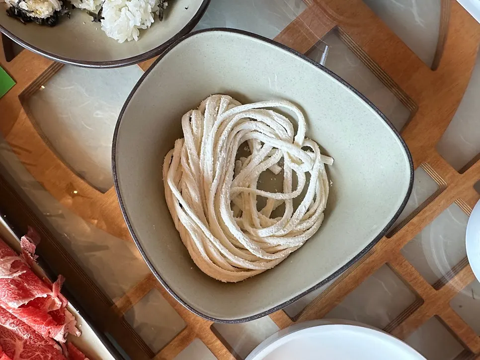Kalguksu noodles cooked in Hyoeunok's beef bone broth