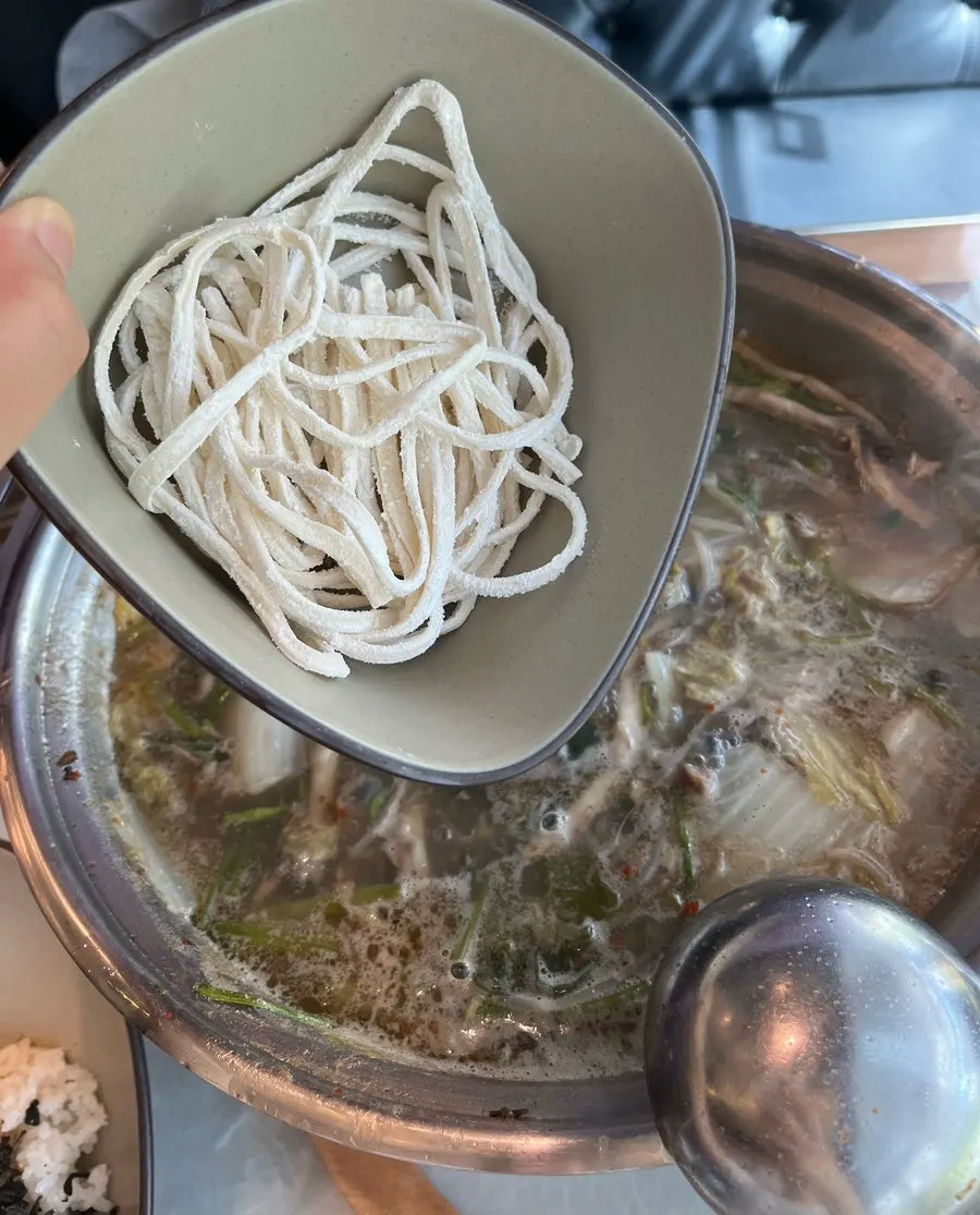 Thin beef slices lightly cooked in the broth, shabu-shabu style