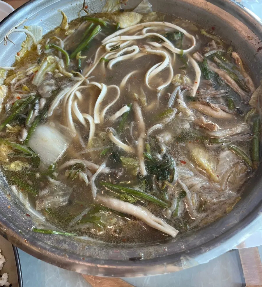 Hot pot with shabu-shabu beef added into the broth