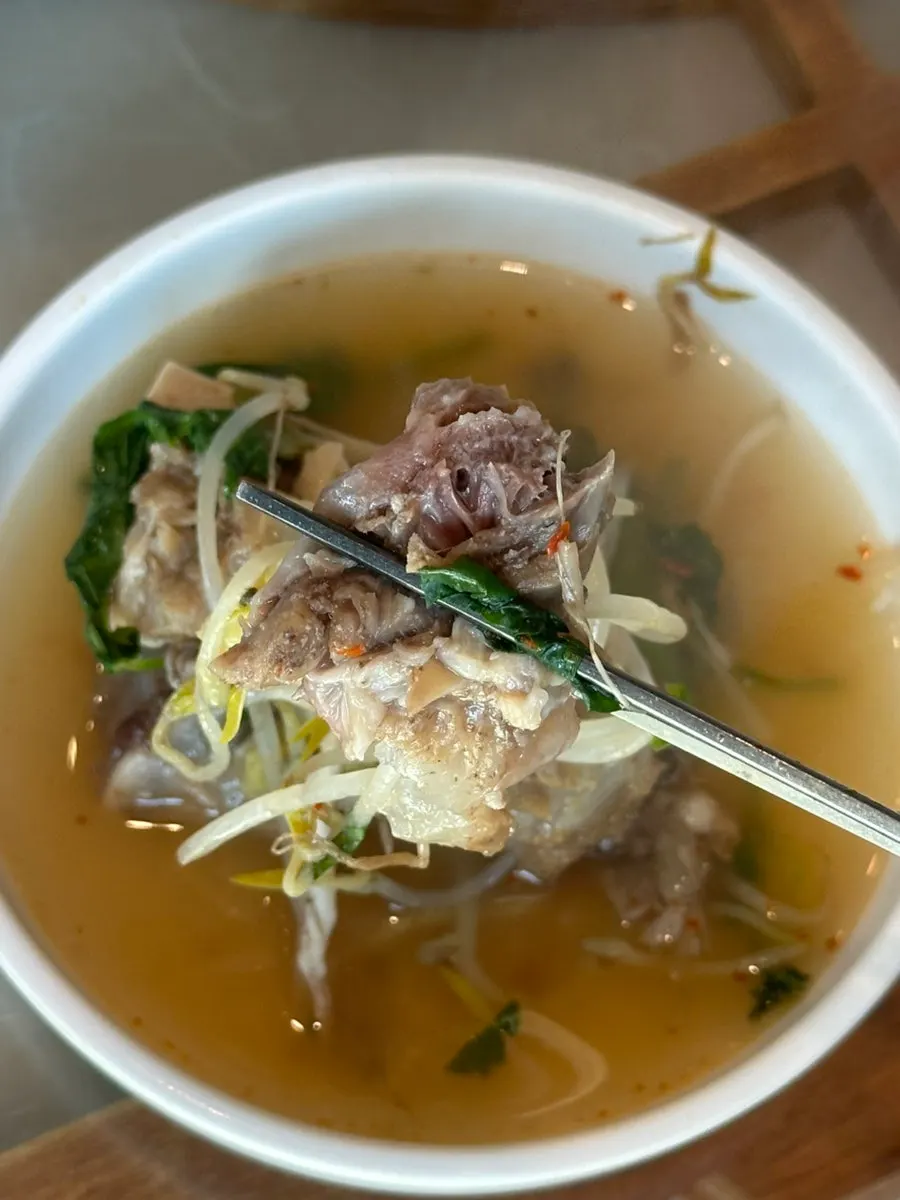 A bite combining meat and vegetables together